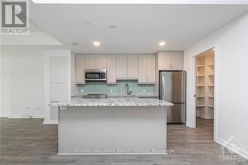 107 - 320 Miwate, Ottawa, ON - Indoor Photo Showing Kitchen With Upgraded Kitchen