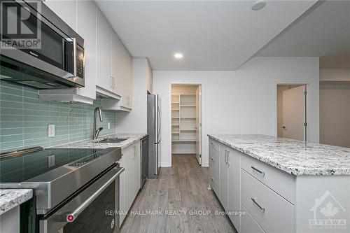 107 - 320 Miwate, Ottawa, ON - Indoor Photo Showing Kitchen With Upgraded Kitchen