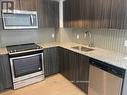 320 - 20 Shore Breeze Drive, Toronto, ON  - Indoor Photo Showing Kitchen With Upgraded Kitchen 