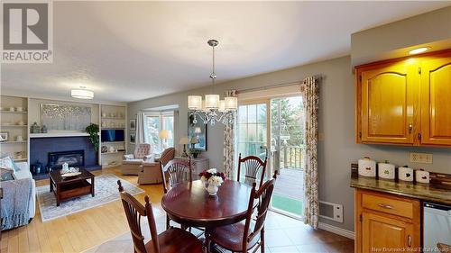 21 Melanie Drive, Quispamsis, NB - Indoor Photo Showing Dining Room With Fireplace