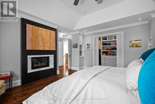 4 Evergreen Gardens, Toronto, ON - Indoor Photo Showing Bedroom With Fireplace