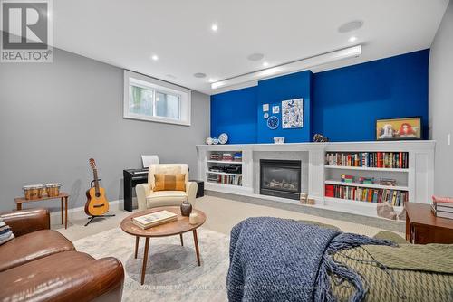 4 Evergreen Gardens, Toronto, ON - Indoor Photo Showing Other Room With Fireplace