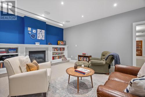 4 Evergreen Gardens, Toronto, ON - Indoor Photo Showing Living Room With Fireplace