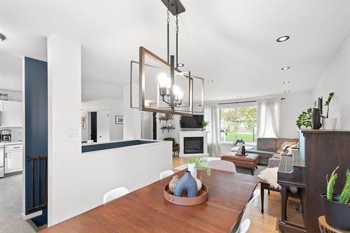 218 Morgan Crescent, Winnipeg, MB - Indoor Photo Showing Dining Room With Fireplace