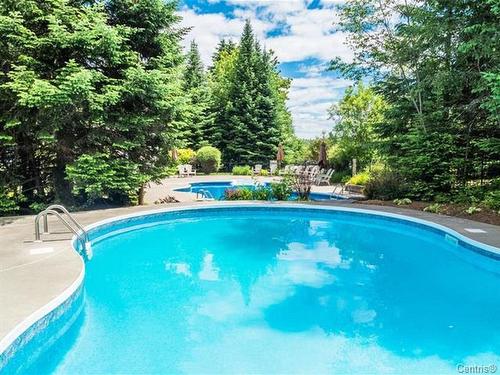 Pool - 1641 Ch. Du Golf, Mont-Tremblant, QC - Outdoor With In Ground Pool With Backyard