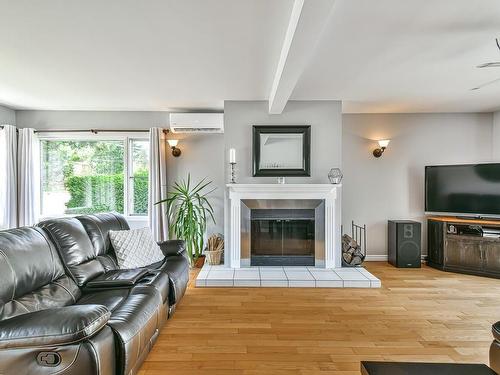 Living room - 119 Rue Demontigny, Sainte-Agathe-Des-Monts, QC - Indoor Photo Showing Living Room With Fireplace