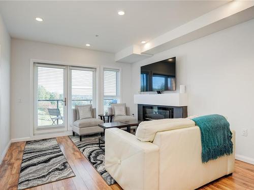 303-745 Travino Lane, Saanich, BC - Indoor Photo Showing Living Room With Fireplace