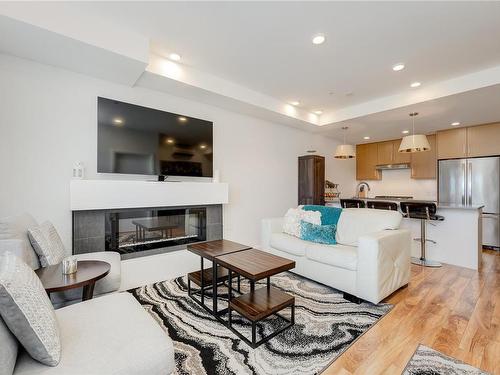 303-745 Travino Lane, Saanich, BC - Indoor Photo Showing Living Room With Fireplace