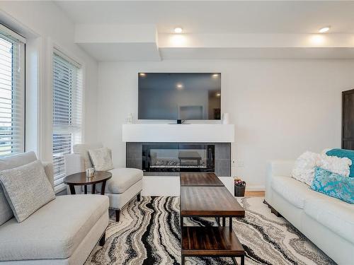 303-745 Travino Lane, Saanich, BC - Indoor Photo Showing Living Room With Fireplace