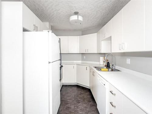 403-649 Bay St, Victoria, BC - Indoor Photo Showing Kitchen With Double Sink