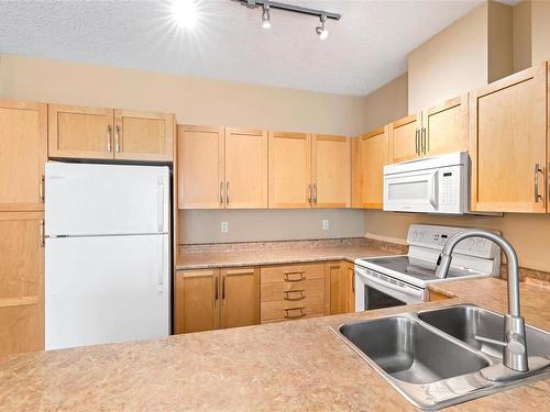 208-1156 Colville Rd, Esquimalt, BC - Indoor Photo Showing Kitchen With Double Sink