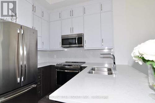 633 - 1105 Leger Way, Milton, ON - Indoor Photo Showing Kitchen With Stainless Steel Kitchen With Double Sink With Upgraded Kitchen