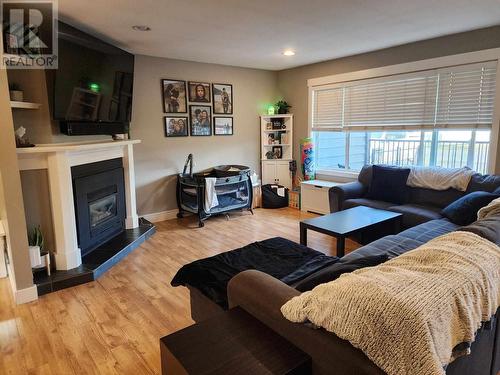 2290 Park Avenue, Lumby, BC - Indoor Photo Showing Living Room With Fireplace