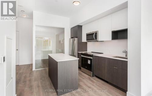 301 - 202 Burnhamthorpe Road E, Mississauga, ON - Indoor Photo Showing Kitchen With Stainless Steel Kitchen