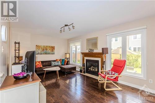 3483 River Run Avenue, Ottawa, ON - Indoor Photo Showing Living Room With Fireplace