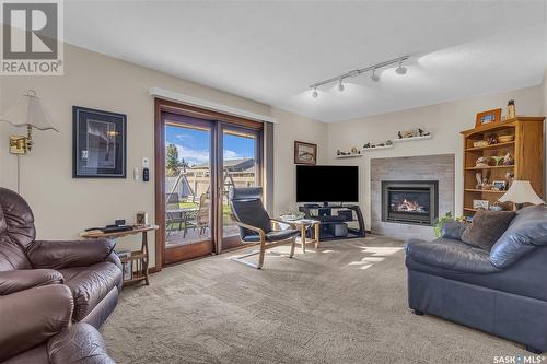 221 Riverbend Crescent, Battleford, SK - Indoor Photo Showing Living Room With Fireplace