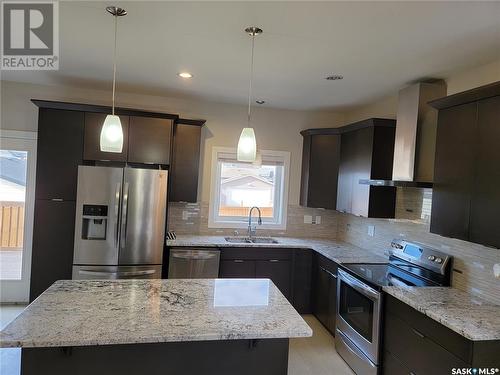 1062 Kloppenburg Bend, Saskatoon, SK - Indoor Photo Showing Kitchen With Stainless Steel Kitchen With Double Sink With Upgraded Kitchen