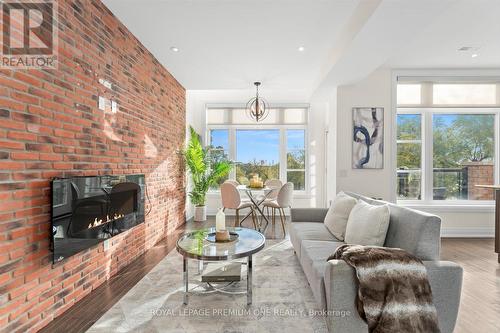 36 - 8169 Kipling Avenue, Vaughan, ON - Indoor Photo Showing Living Room With Fireplace