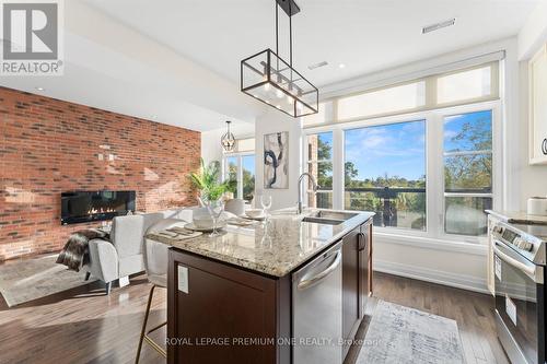 36 - 8169 Kipling Avenue, Vaughan, ON - Indoor Photo Showing Kitchen With Fireplace