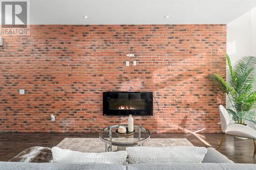 36 - 8169 Kipling Avenue, Vaughan, ON - Indoor Photo Showing Living Room With Fireplace