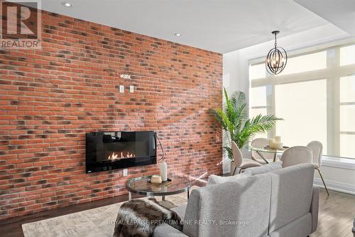 36 - 8169 Kipling Avenue, Vaughan, ON - Indoor Photo Showing Living Room With Fireplace