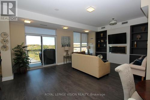 302 - 11611 Yonge Street, Richmond Hill, ON - Indoor Photo Showing Living Room With Fireplace