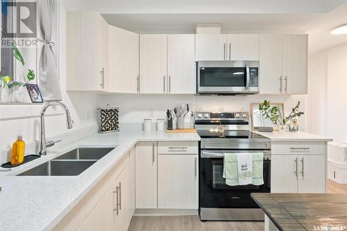 222 Mcarthur Crescent, Saskatoon, SK - Indoor Photo Showing Kitchen With Stainless Steel Kitchen With Double Sink