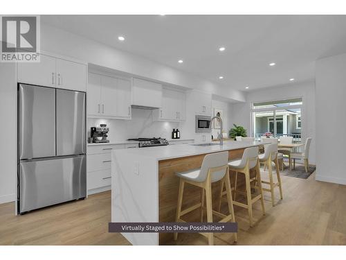 Modern two-tone kitchen - virtually staged - 5300 Main Street Unit# 120, Kelowna, BC - Indoor Photo Showing Other Room