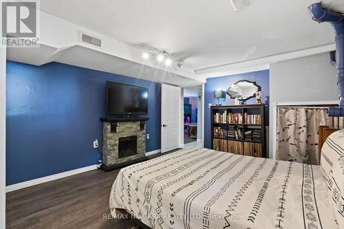 11366 Highway 3, Wainfleet, ON - Indoor Photo Showing Bedroom With Fireplace