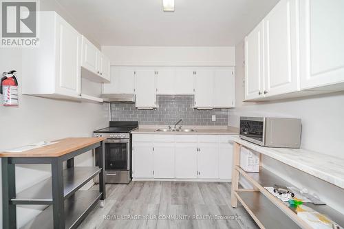 Upper - 86 Lesmount Avenue, Toronto, ON - Indoor Photo Showing Kitchen With Double Sink