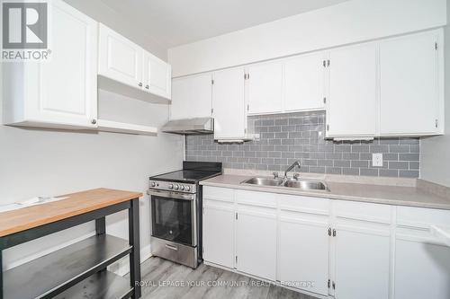 Upper - 86 Lesmount Avenue, Toronto, ON - Indoor Photo Showing Kitchen With Double Sink