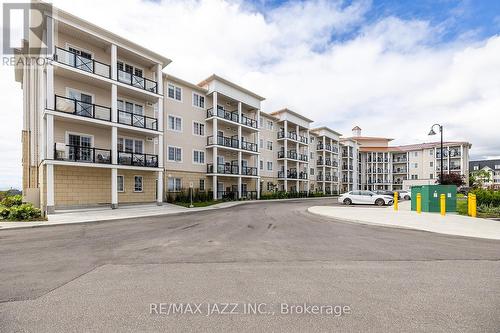 401 - 50 Lakebreeze Drive, Clarington (Newcastle), ON - Outdoor With Balcony With Facade