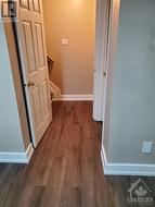 Entrance to lower level with new flooring. - 