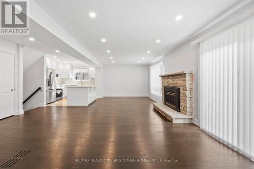 Mn & Bs - 194 Romfield Circuit, Markham, ON - Indoor Photo Showing Living Room With Fireplace