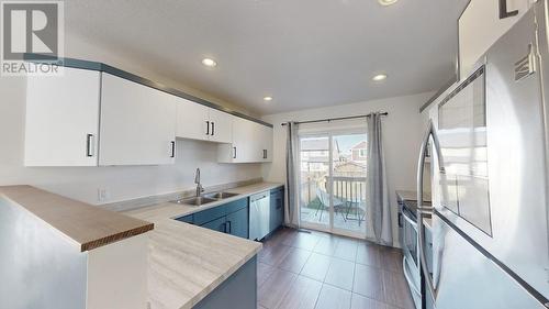 8404 85 Avenue, Fort St. John, BC - Indoor Photo Showing Kitchen With Double Sink