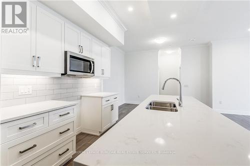 101 - 1880 Gordon Street, Guelph, ON - Indoor Photo Showing Kitchen With Double Sink