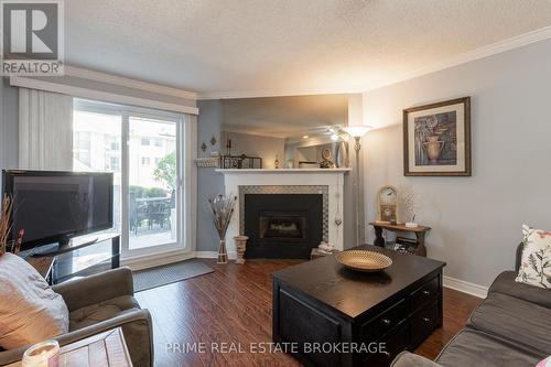 111 - 735 Deveron Crescent, London, ON - Indoor Photo Showing Living Room With Fireplace