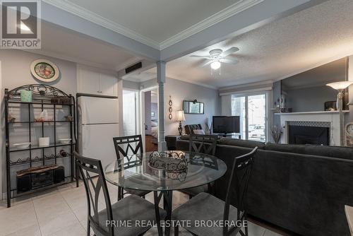 111 - 735 Deveron Crescent, London, ON - Indoor Photo Showing Dining Room With Fireplace