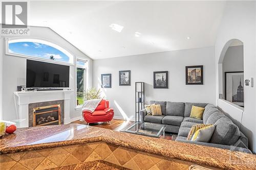 Living Room - 6978 Lakes Park Drive, Greely, ON - Indoor Photo Showing Living Room With Fireplace