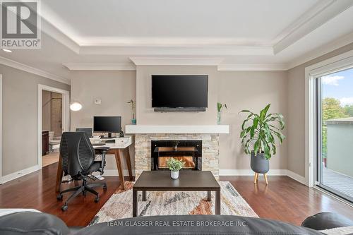 414 - 320 Sugarcreek Trail, London, ON - Indoor Photo Showing Living Room With Fireplace