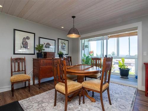 404-9958 Daniel St, Chemainus, BC - Indoor Photo Showing Dining Room With Fireplace