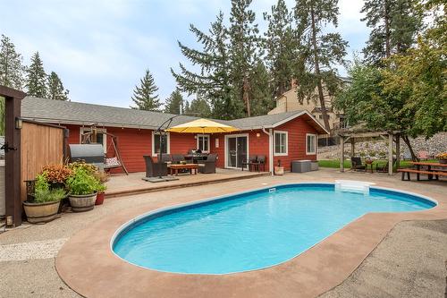 677 Drummond Court, Kelowna, BC - Outdoor With In Ground Pool With Deck Patio Veranda With Backyard