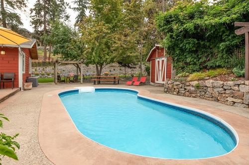 677 Drummond Court, Kelowna, BC - Outdoor With In Ground Pool With Backyard