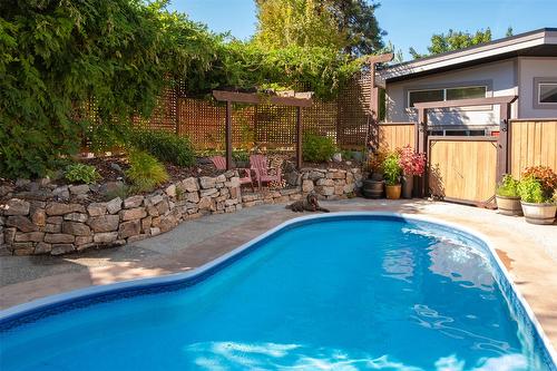 677 Drummond Court, Kelowna, BC - Outdoor With In Ground Pool With Deck Patio Veranda With Backyard