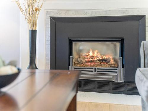 403-1234 Fort St, Victoria, BC - Indoor Photo Showing Living Room With Fireplace