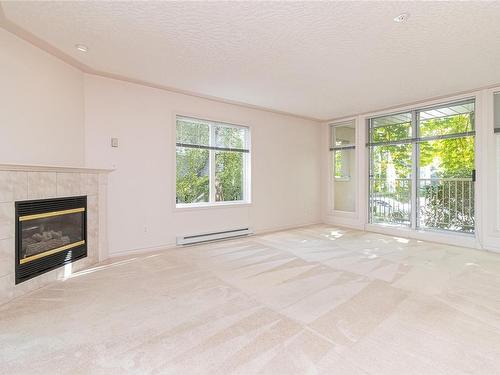 103-9905 Fifth St, Sidney, BC - Indoor Photo Showing Living Room With Fireplace