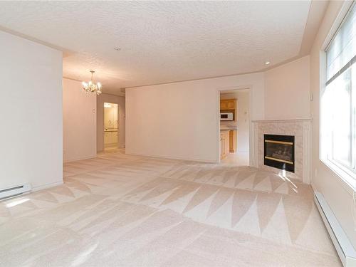 103-9905 Fifth St, Sidney, BC - Indoor With Fireplace