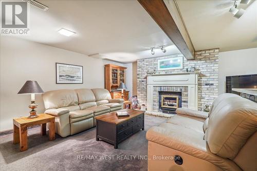 219 Bayshore Road W, Innisfil, ON - Indoor Photo Showing Living Room With Fireplace