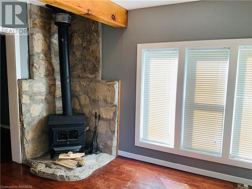 Master sitting area wood fireplace - 20 Cape Hurd Road S, Tobermory, ON - Indoor With Fireplace