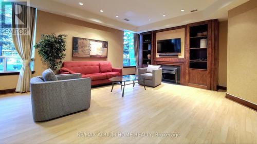 202 - 35 Finch Avenue E, Toronto, ON - Indoor Photo Showing Living Room With Fireplace